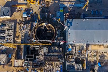 Aerial view of a nuclear power plant under construction showing the circular reinforced concrete containment building that will house the reactor and primary circuit systems. (Source: © hlxandr / stock.adobe.com) Aerial view of a nuclear power plant under construction showing the circular reinforced concrete containment building that will house the reactor and primary circuit systems. (Source: © hlxandr / stock.adobe.com)