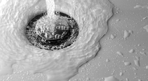 Why does the water in a washbasin spin the other way round in the northern and southern hemispheres when you drain it?