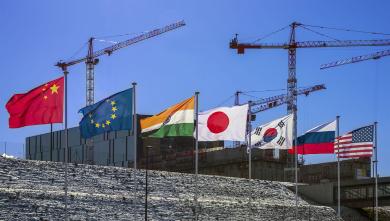 The flags of the seven ITER Members — China, the European Union, India, Japan, Korea, Russia, and the United States — fly over the worksite. (Credit © ITER Organization, www.iter.org) The flags of the seven ITER Members — China, the European Union, India, Japan, Korea, Russia, and the United States — fly over the worksite. (Credit © ITER Organization, www.iter.org)
